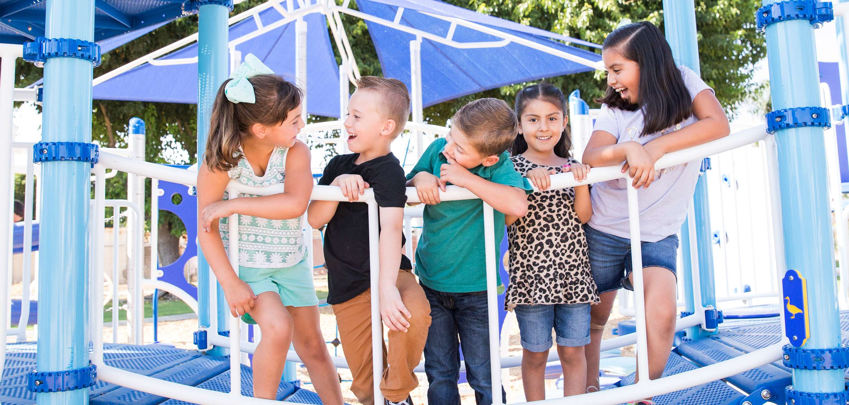 children on playground bridge